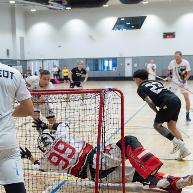 Goal-mouth action at the Bangkok Floorball Tournament